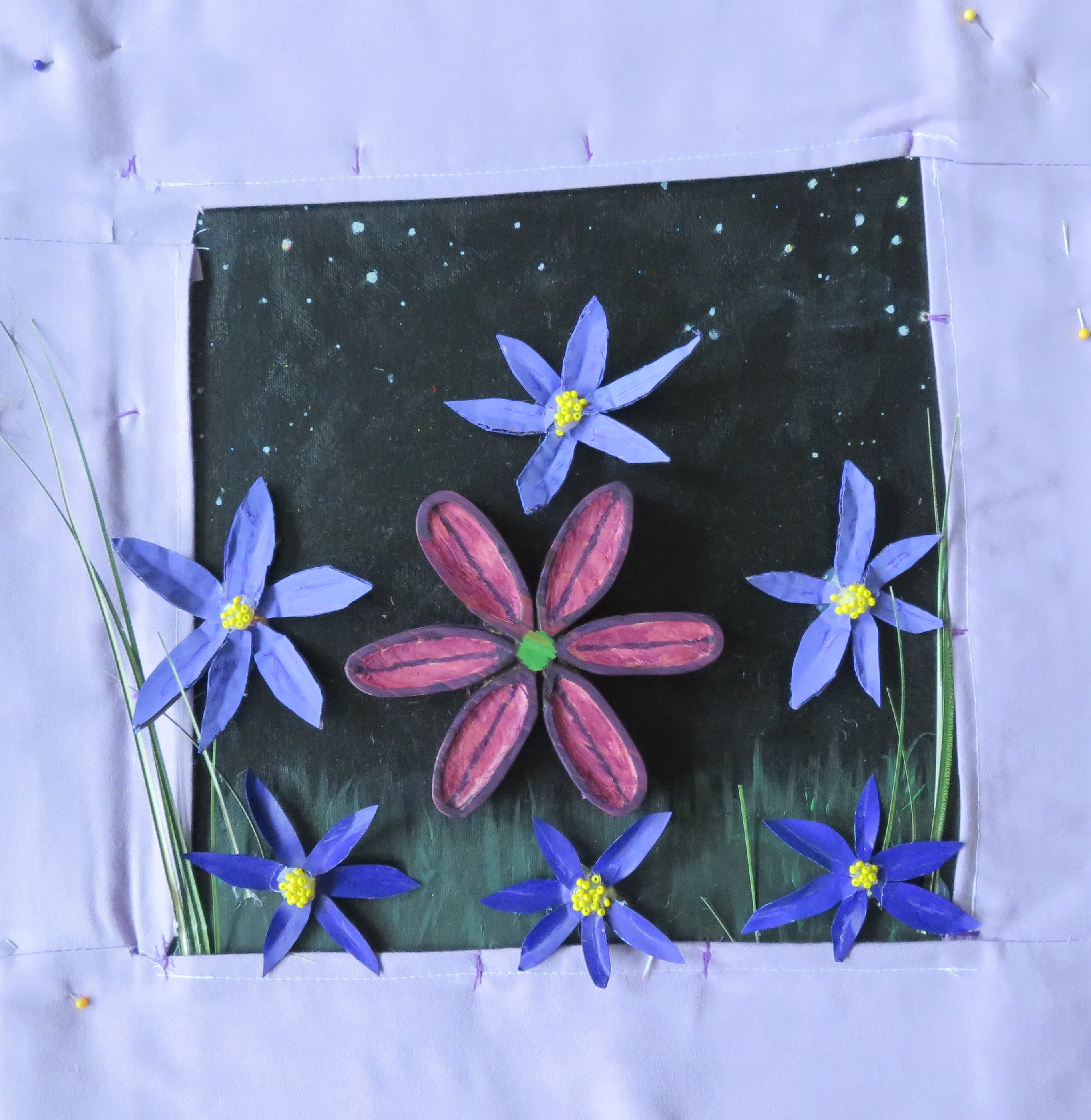 A quilt square decorated with camas flowers